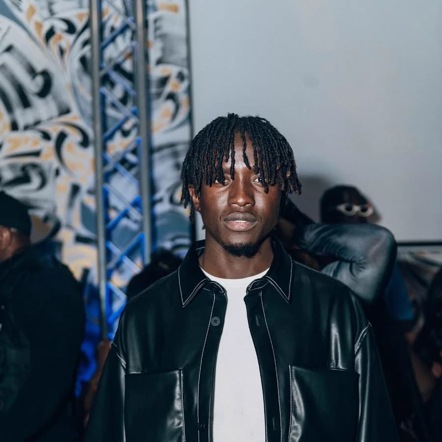 Dizzle in a black leather jacket.