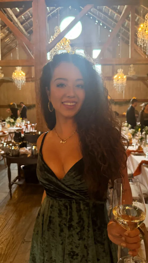 Jessica at an evening event in a candlelit barn.