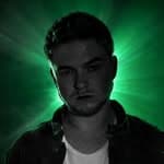 One Take Jake, lit from behind in green light.