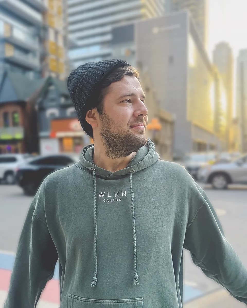 Zach Harder on a city street at golden hour.